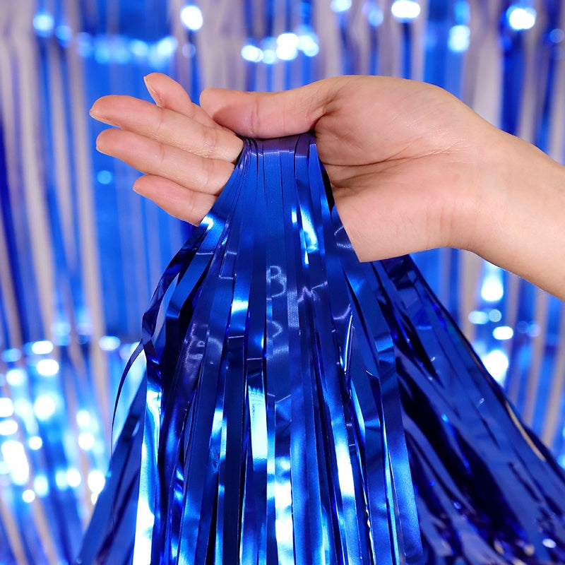 Shiny blue foil fringe curtain party backdrop
