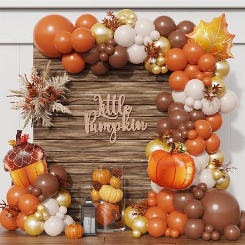 “Thanksgiving balloon setup with Satin Pumpkin balloon in rustic decor”
