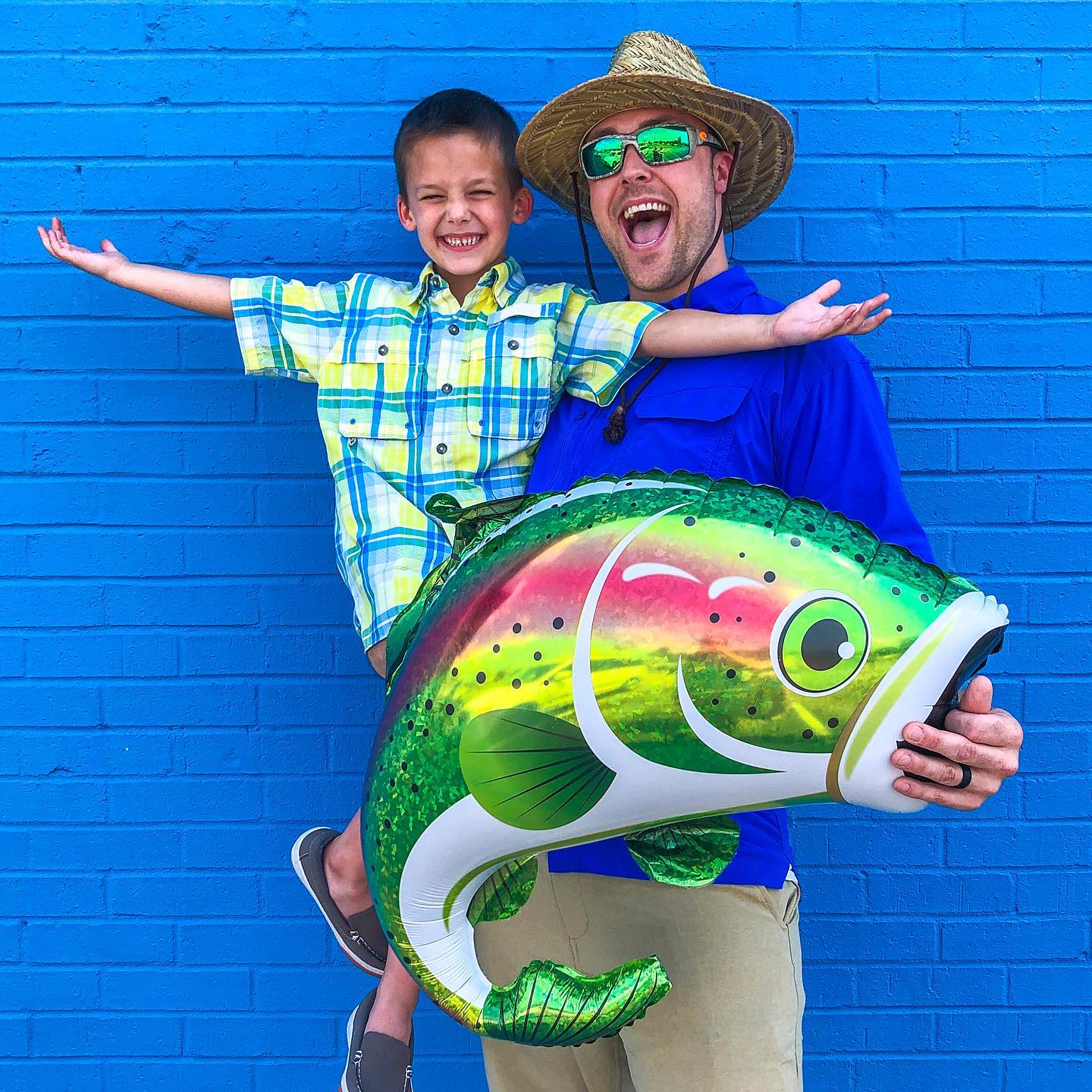 Rainbow trout fish holographic foil balloon with shiny colorful details for fishing-themed party decoration