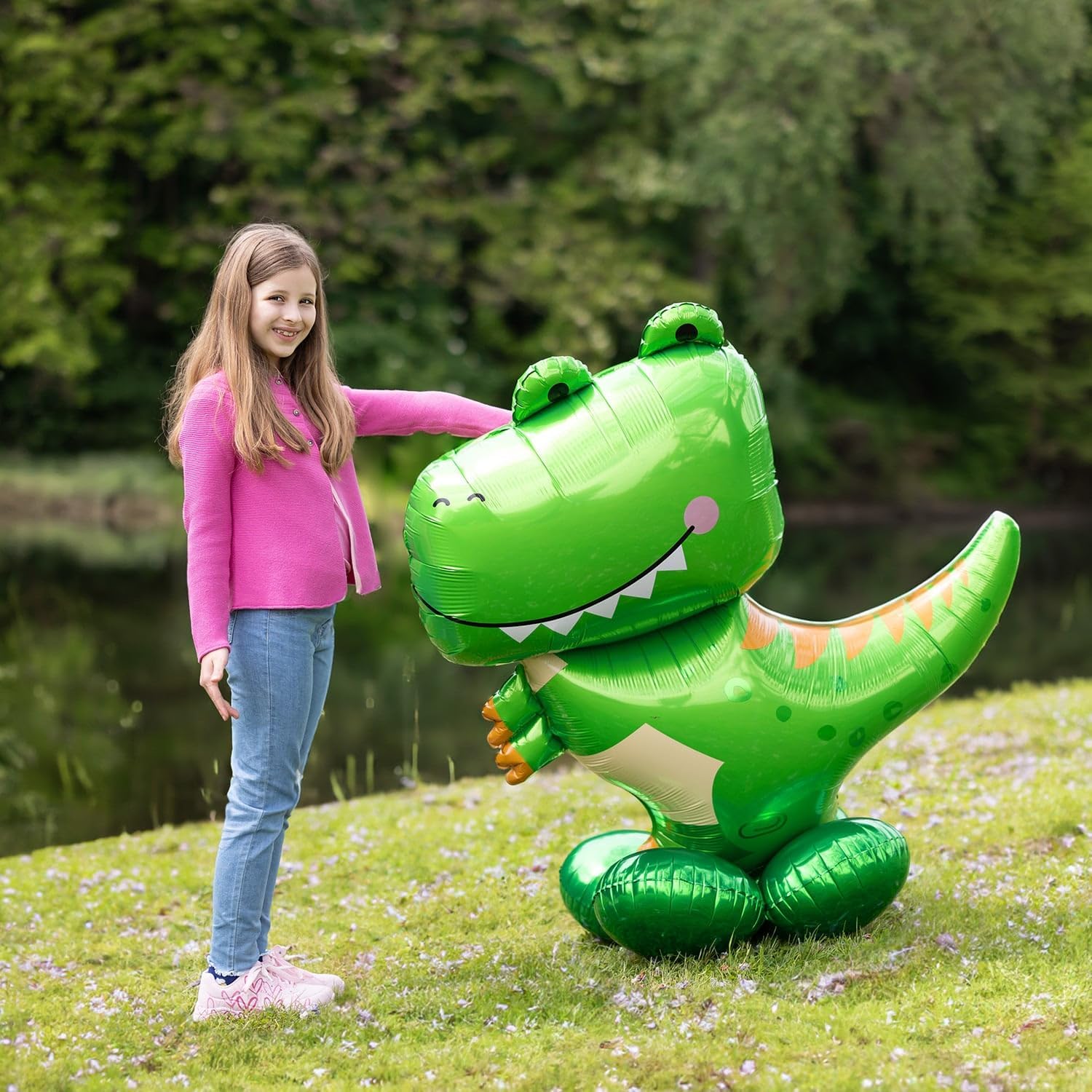 Large T-Rex Airloonz balloon next to girl at outdoor party – dinosaur balloon 45 inch
