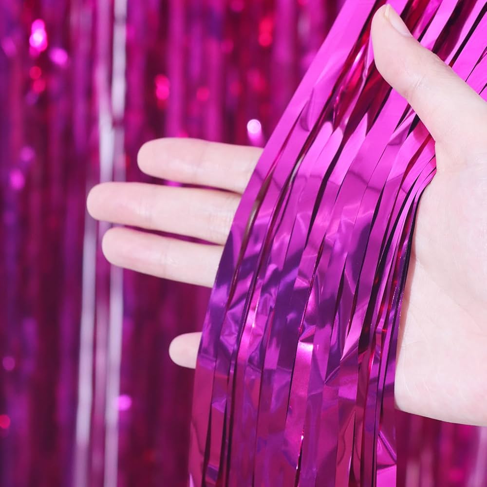 “Close-up of fuchsia metallic fringe curtain”