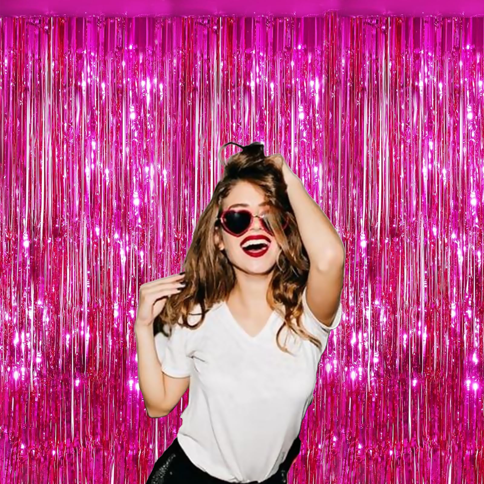 “Close-up of fuchsia metallic fringe curtain”