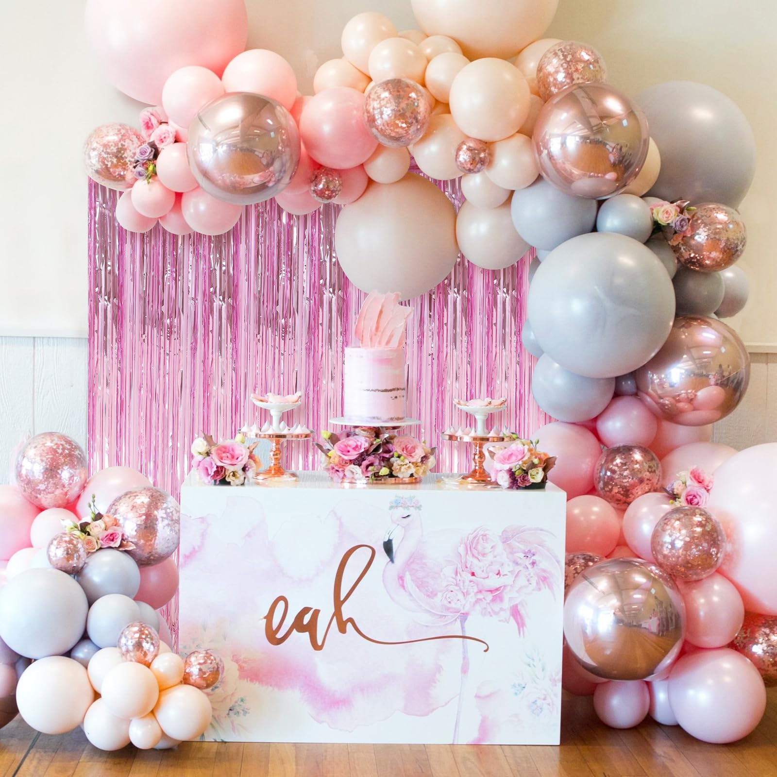 “Pink foil curtain with balloons decoration”