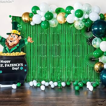 “Metallic green curtain with balloon garland”