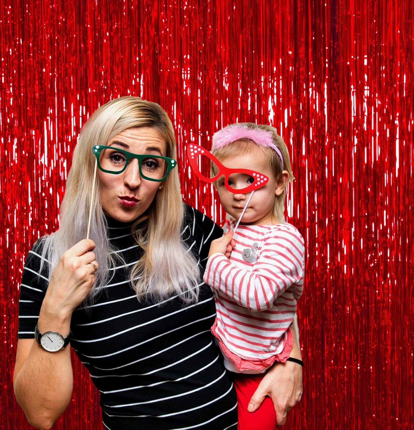 Red foil backdrop with fringe for birthday party photos
