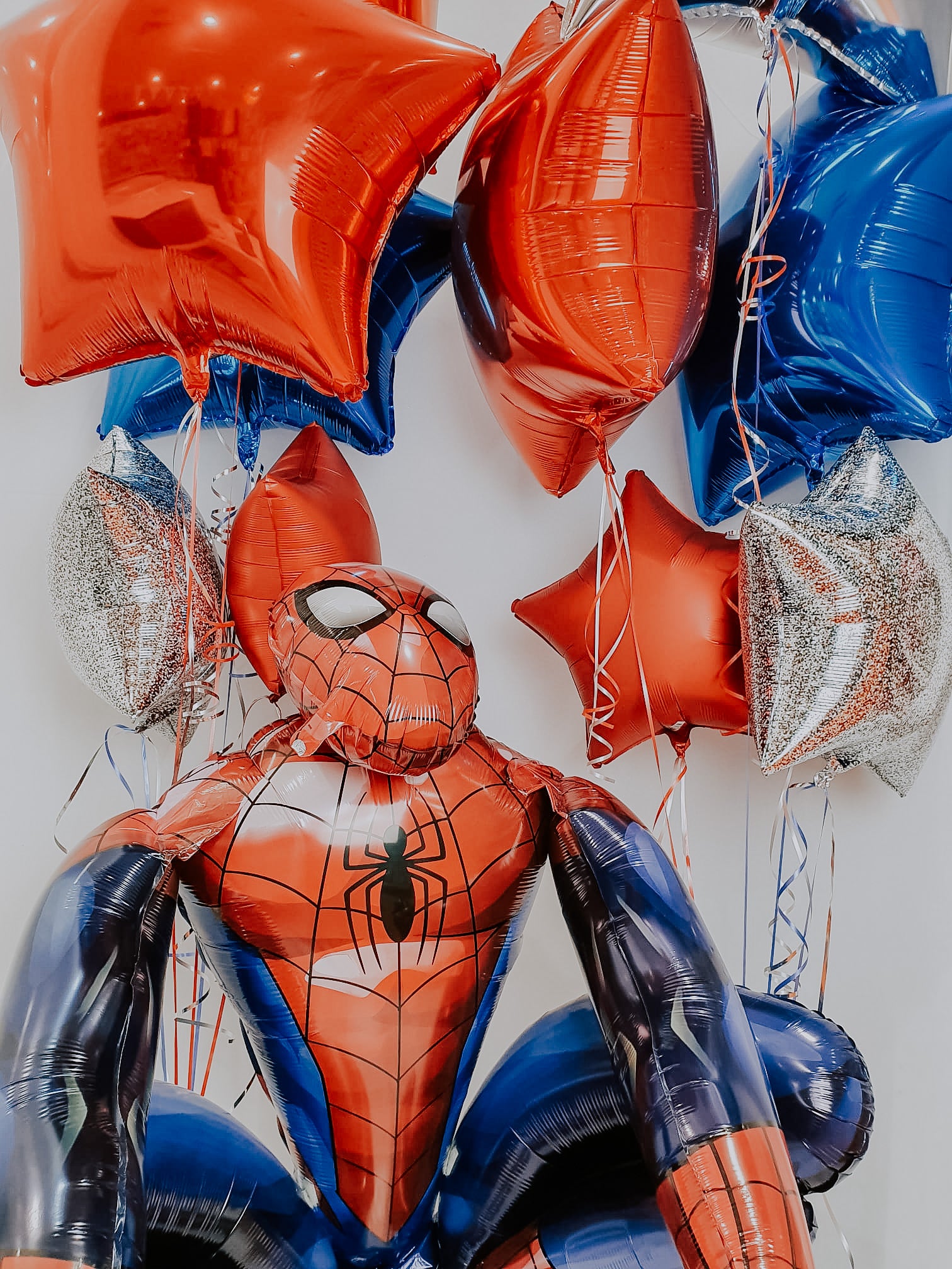 Spider-Man balloon display with birthday balloons