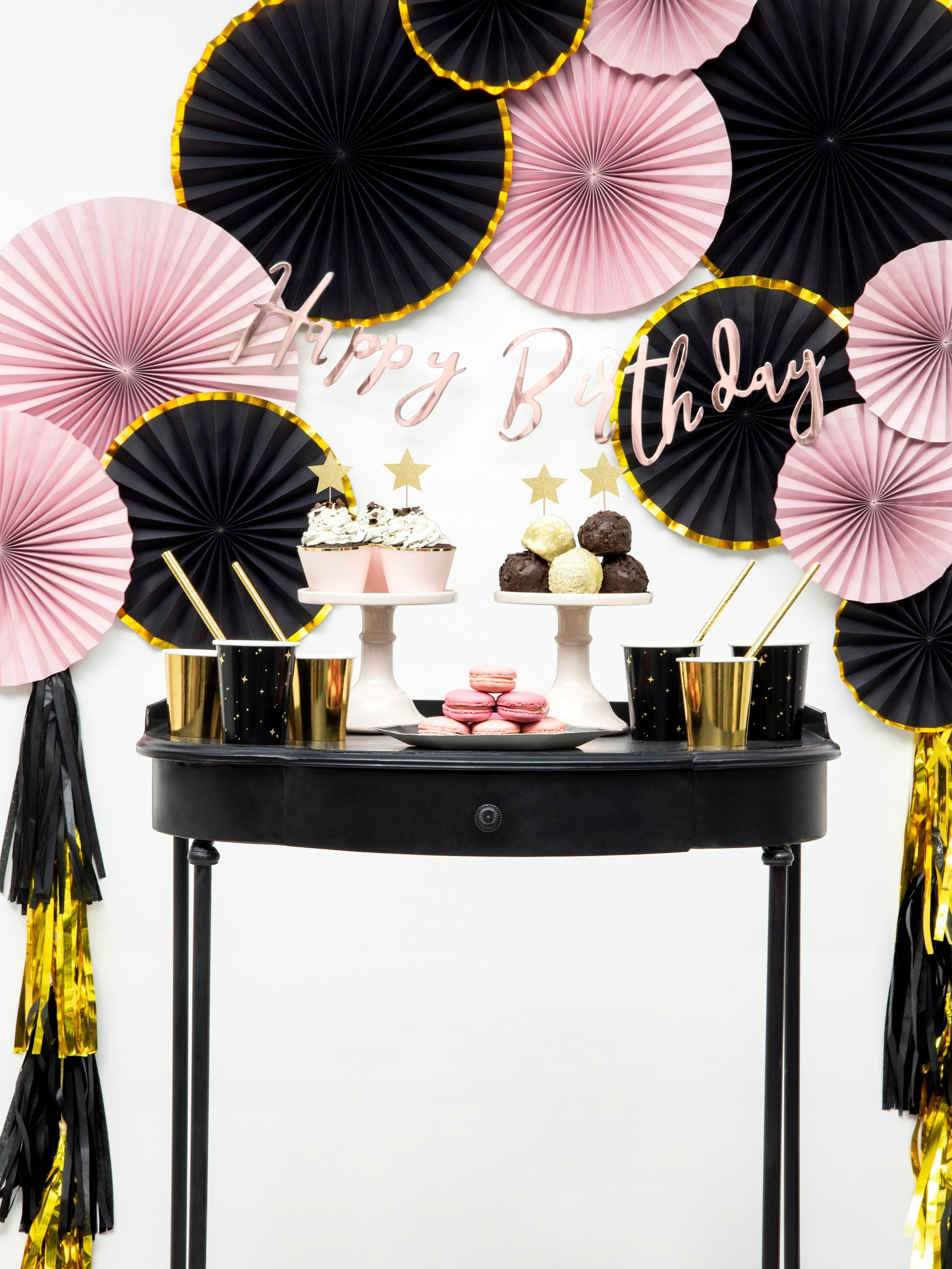 Party setup with pink and black rosette mix