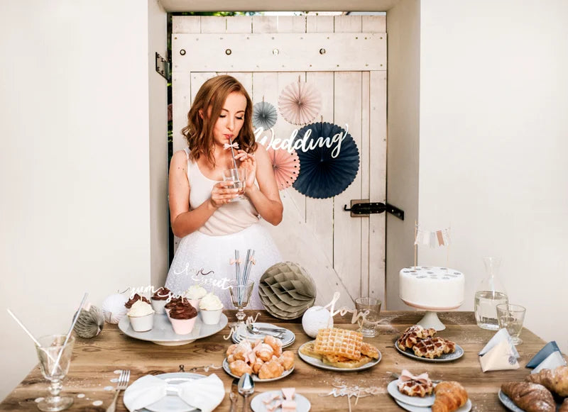 Elegant dessert table with soft-tone paper fans