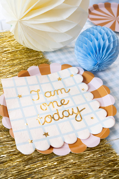 Party table set with “I Am One Today” napkins and teddy bear decorations