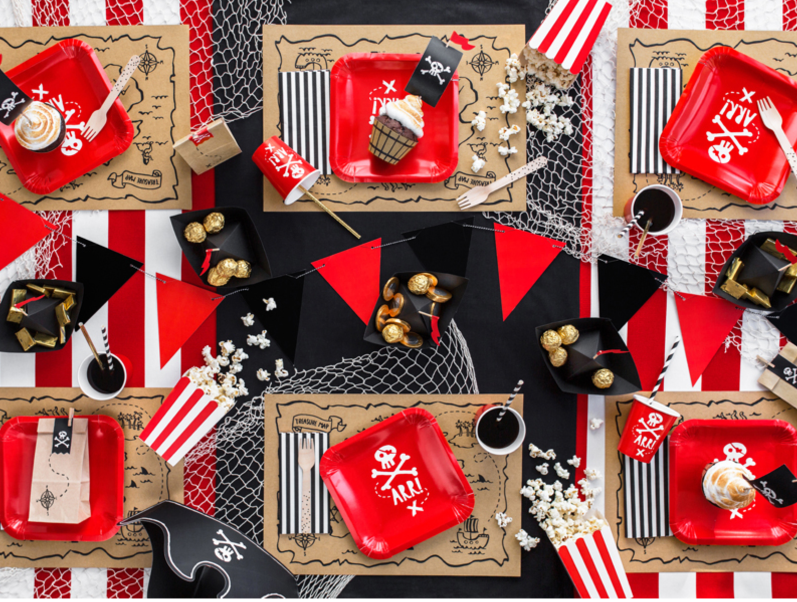 “Pirate-themed tableware set with red pirate cups and plates”