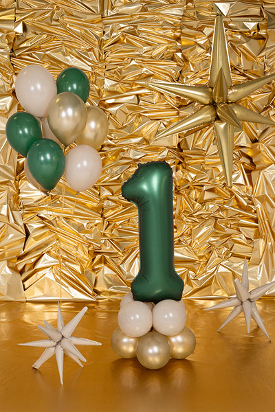 Number 1 balloon used in birthday decoration with gold and white details