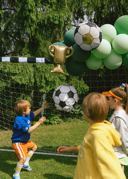 Foil balloons trophy with soccer balls for garlands decoration