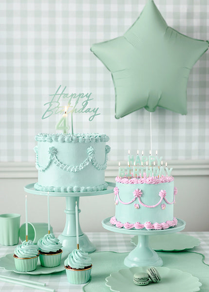 Pastel green star balloon styled in a dessert table display