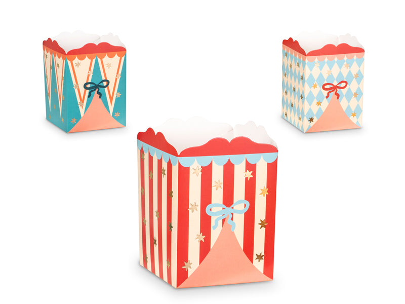 Circus-themed snack boxes in red, blue, and yellow with clown designs