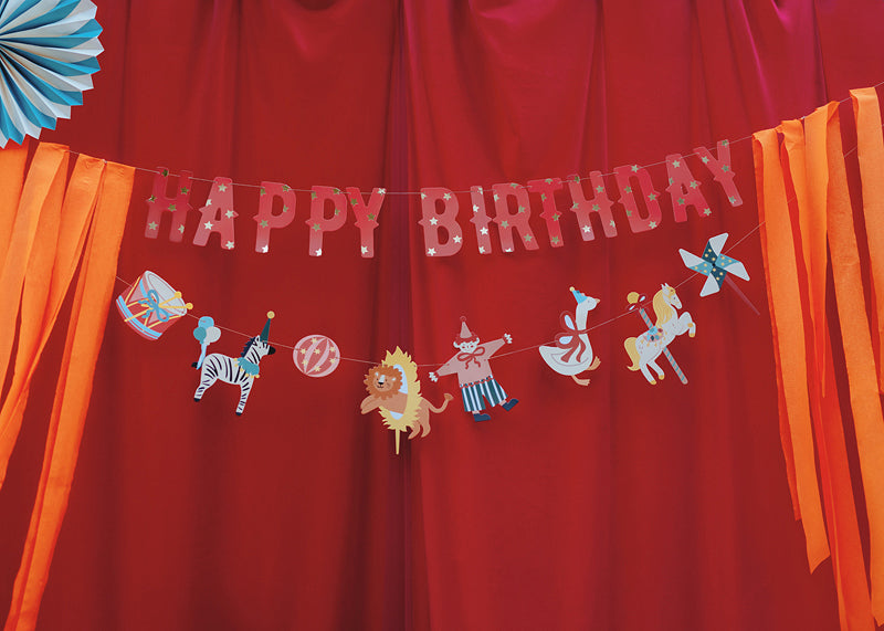 Circus-themed happy birthday banner with colorful animals and letters for party decoration