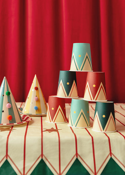Colorful circus-themed party cups with drum design in red, teal, and navy