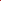 Vibrant red rectangular tablecloth draped neatly over a wooden table.