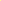 Bright yellow rectangular tablecloth draped over a wooden table.