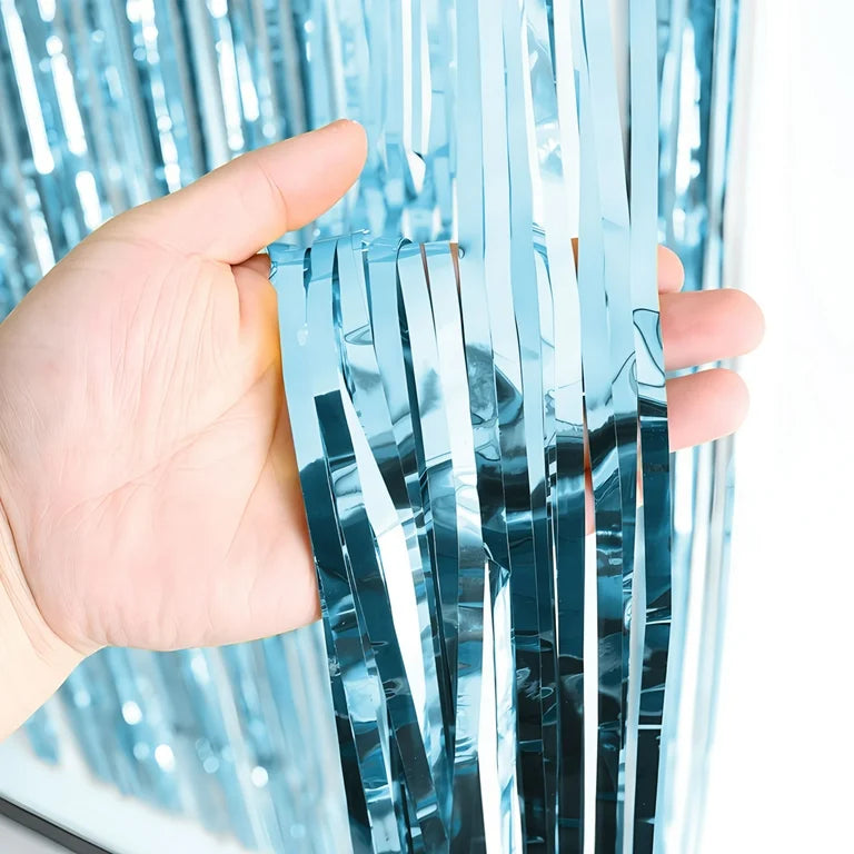 “Light blue foil fringe curtain close-up”