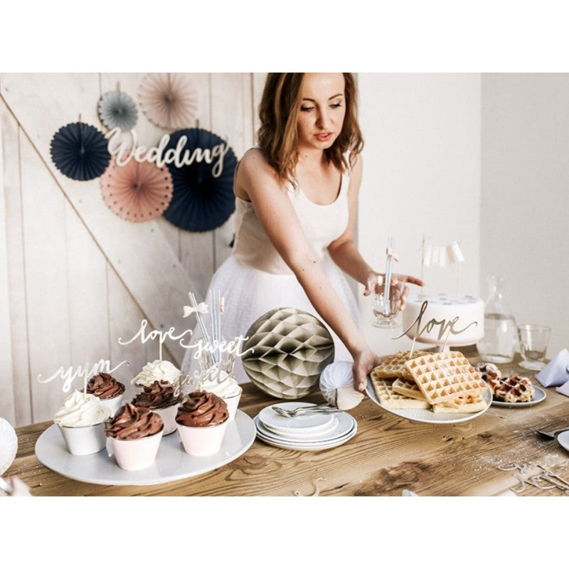 Elegant dessert table with soft-tone paper fans