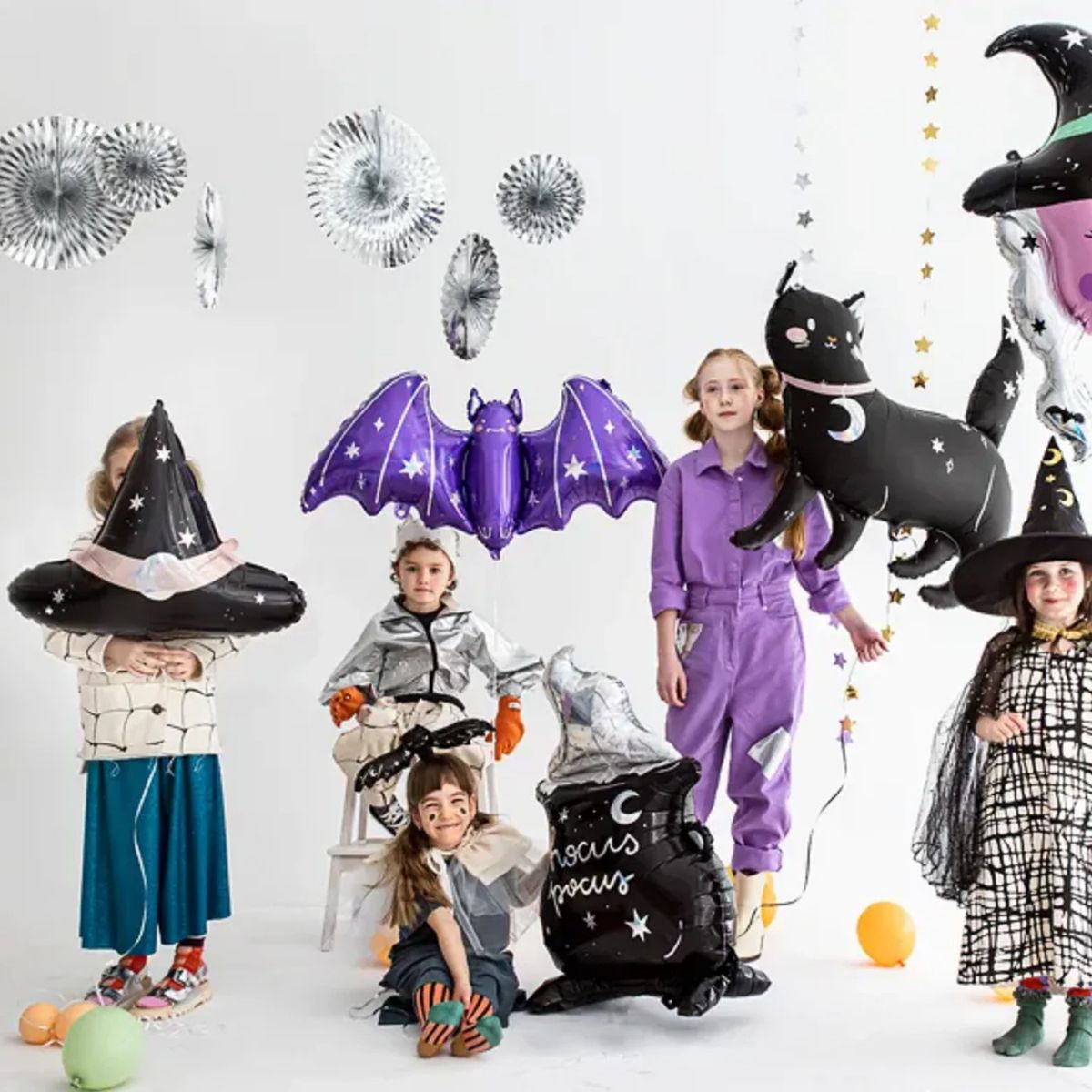 Kids Halloween party with giant black cat balloon