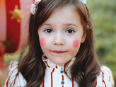 Girl smiling while wearing a party hat