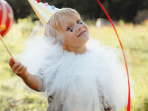 Girl smiling while wearing a party hat