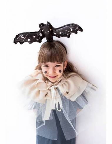 “Child wearing bat foil balloon for Halloween costume”