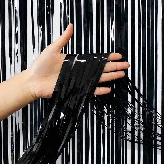 “Black metallic fringe curtain backdrop”