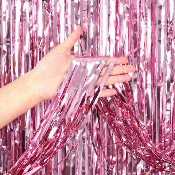 “Metallic pink fringe curtain backdrop”
