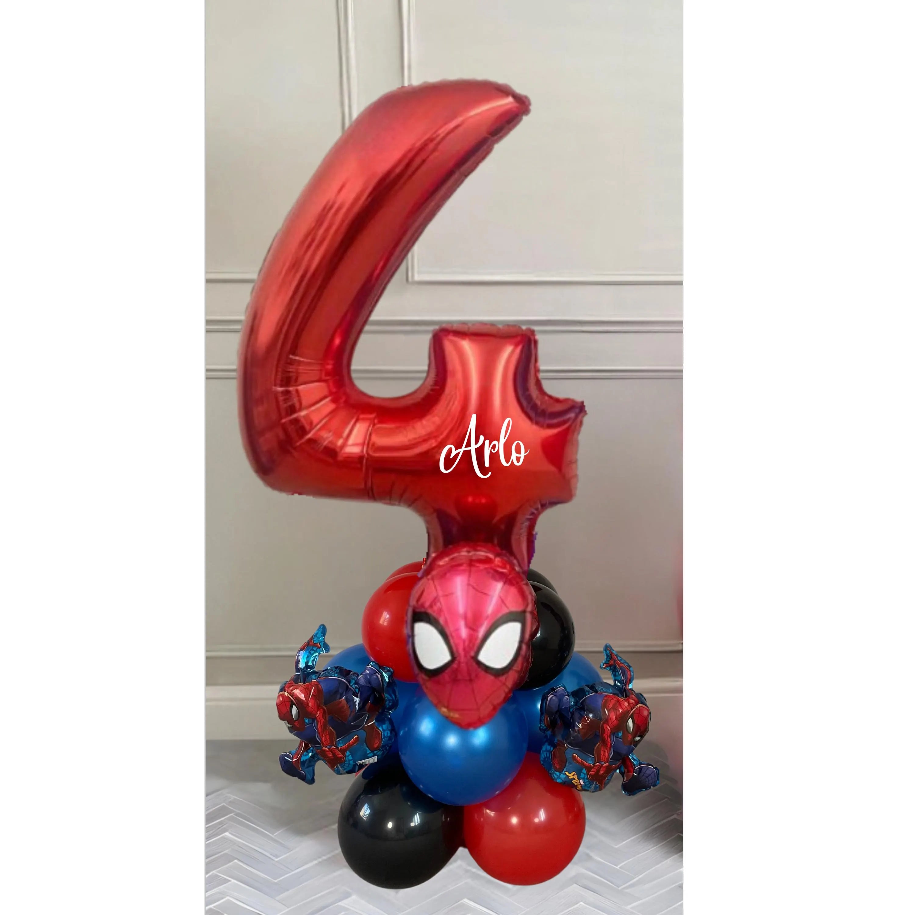 "Balloon arrangement with Spider-Man figure and blue-red colors"