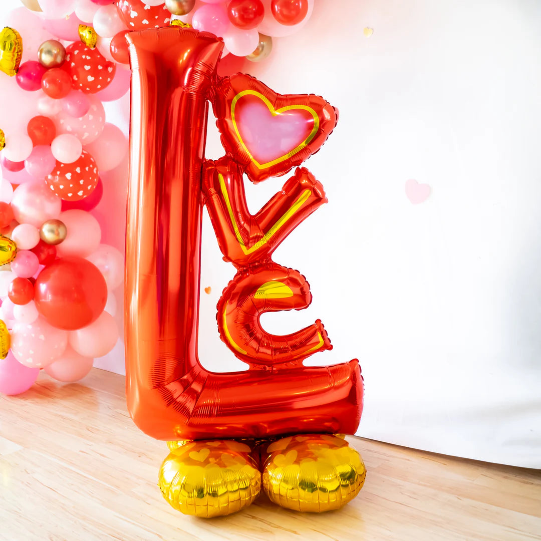 Big Love Airloonz balloon with pink backdrop and balloons – romantic party decor