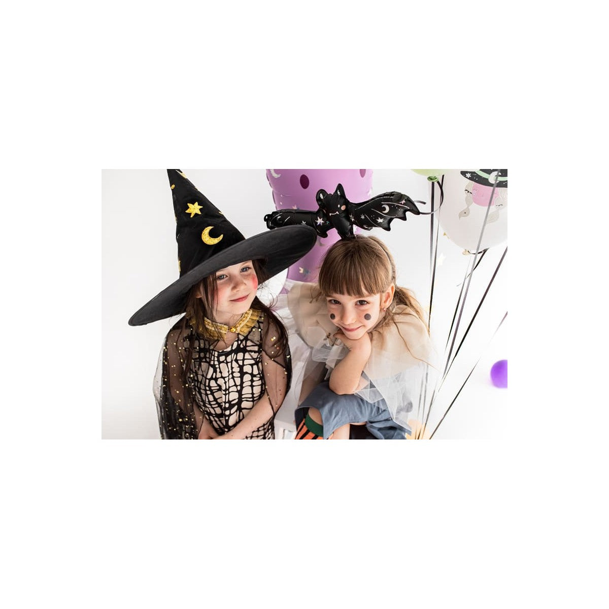 “Kids with Halloween foil bat balloon on headbands”