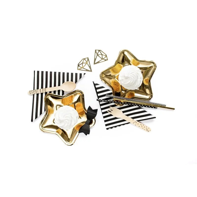 "Elegant table setup with gold accents and striped napkins"