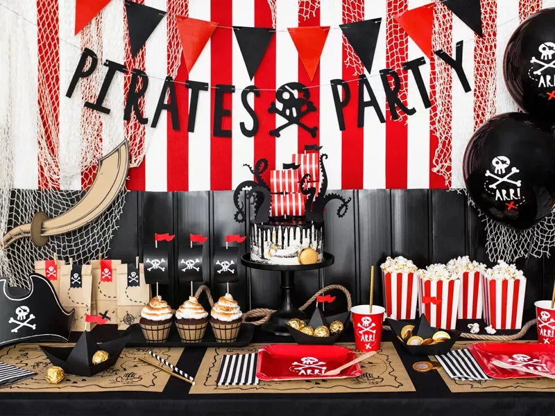 “Pirate party setup with red paper cups and banners”
