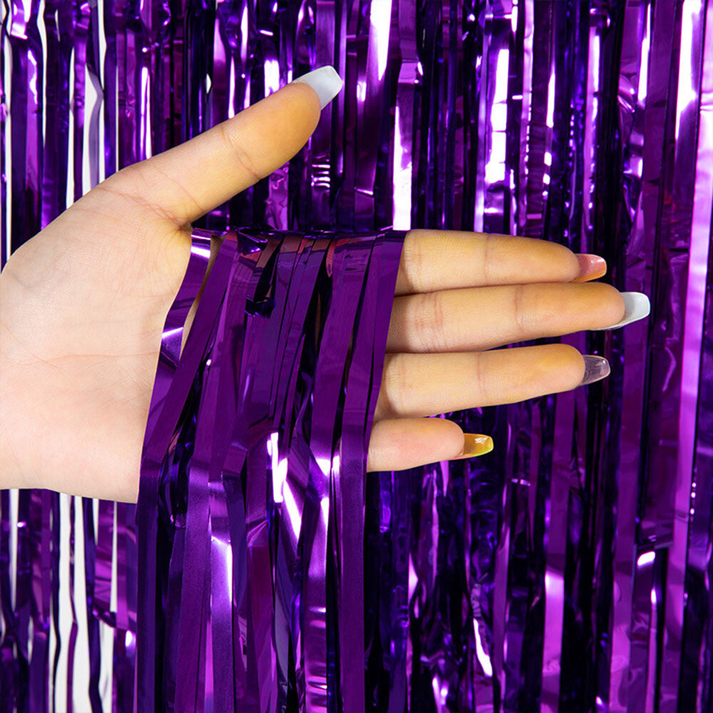 Shiny purple metallic fringe curtain close-up
