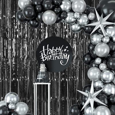 “Black metallic fringe curtain backdrop for birthday celebration”