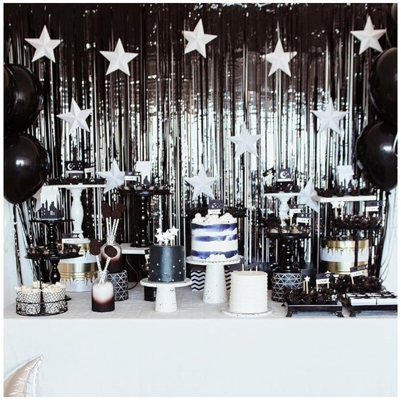 “Black metallic fringe curtain backdrop for sweets table”
