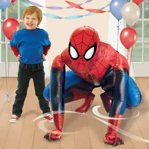 Child posing next to Spider-Man foil balloon